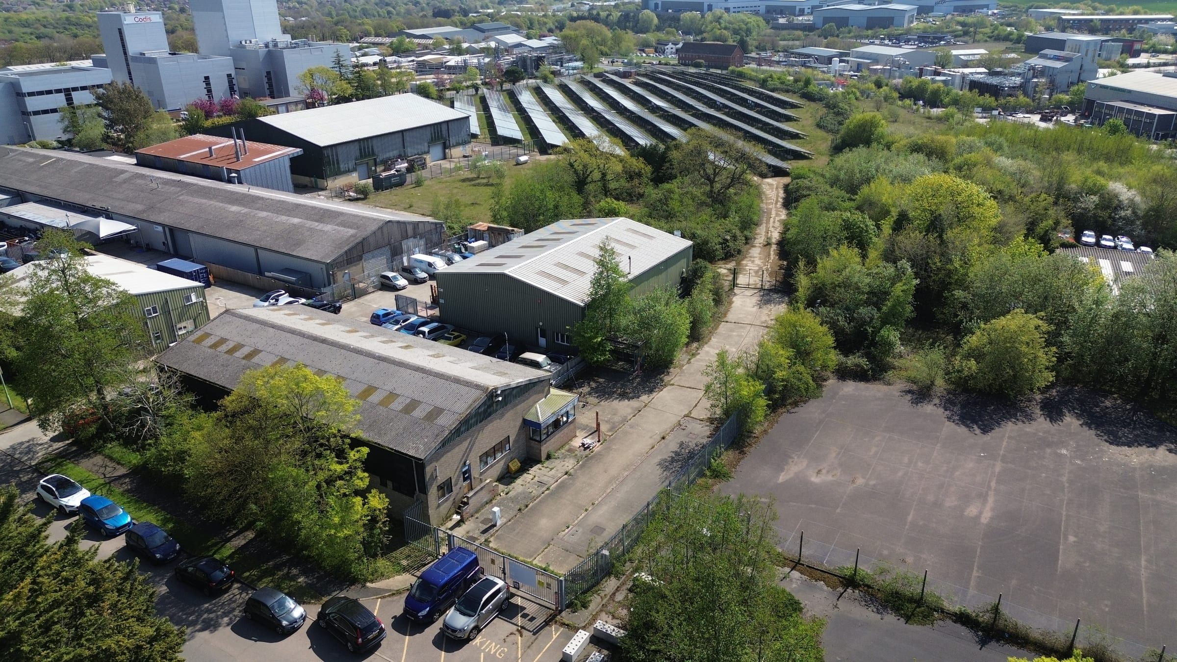 Aerial view of industrial estate with warehouses and workshop units